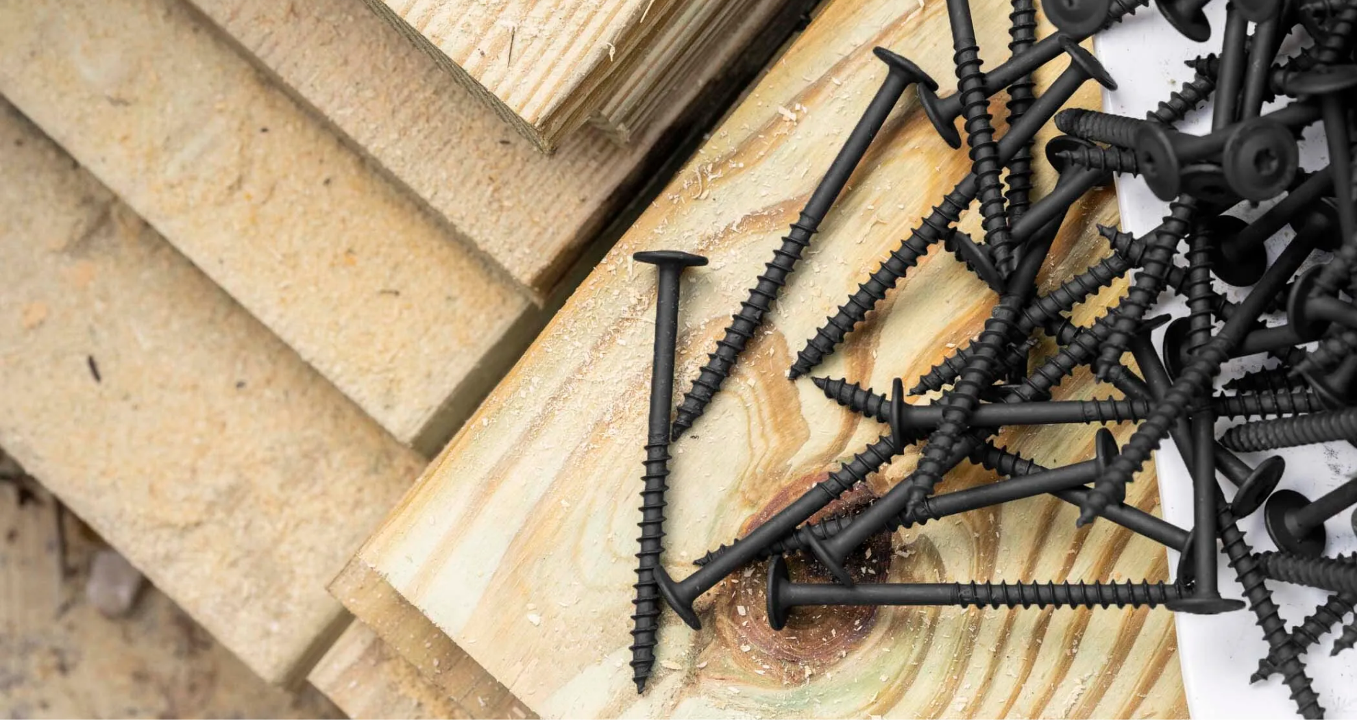 large black SPAX screws on top of lumber 